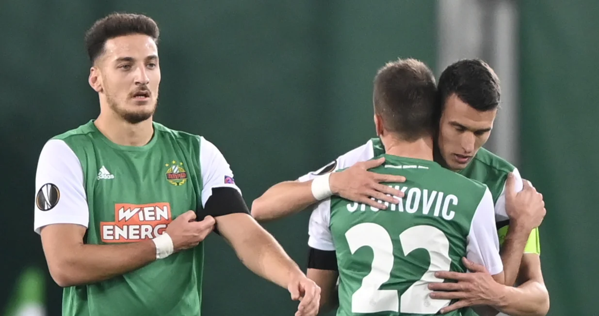 epa08800940 Dejan Ljubicic (R) of Rapid celebrates with teammate Filip Stojkovic after scoring the 1-1 during the UEFA Europa League group B match between Rapid Vienna and Dundalk in Vienna, Austria, 05 November 2020. EPA/CHRISTIAN BRUNA