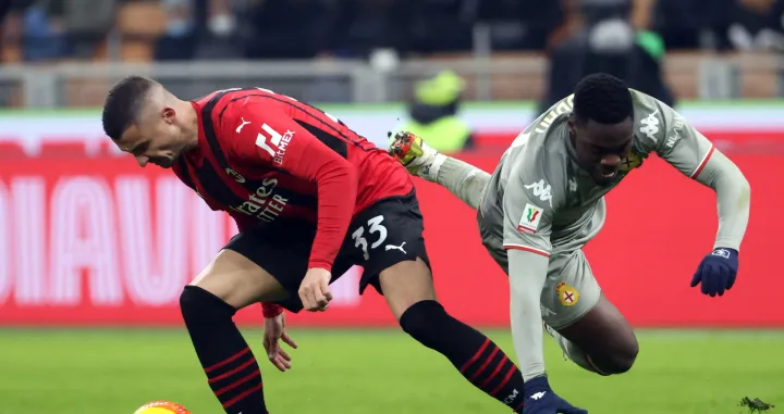 epa09683837 Milan's Rade Krunic (L) challenges for the ball Genoa's Caleb Ekuban during the Italy Cup round of 16 between AC Milan and Genoa CFC at the Giuseppe Meazza stadium in Milan, Italy, 13 January 2022. EPA/MATTEO BAZZI