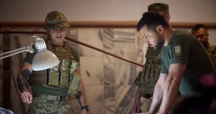 epa10059230 A handout photo made available by via the official Telegram channel of the President of Ukraine on 08 July 2022 shows Ukrainian President Volodymyr Zelensky (R) during a visit to advanced positions in the Dnipropetrovsk region, Ukraine. Zelensky held a meeting on the situation in the region and the state of affairs in military units, he said in a post on his channel. EPA/TELEGRAM/V_Zelenskiy_official/HANDOUT HANDOUT EDITORIAL USE ONLY/NO SALES/Telegram/v_zelenskiy_official/Handout