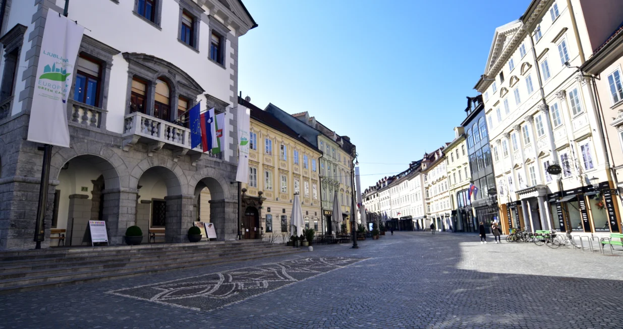 epa08297637 A view of an almost empty area of the old town, in Ljubljana, Slovenia, 16 March 2020. Slovenian government announced that bars and restaurants, and all places of public entertainment will be temporarily closed, public transportation will also be suspended and the shutdown of educational institutions will extend, starting from 15 March 2020. Groceries, pharmacies, banks, post offices, petrol stations will not be closed. EPA/IGOR KUPLJENIK/Igor Kupljenik