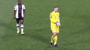epa10322835 Goalkeeper Manuel Neuer (R) of Germany and teammate Youssoufa Moukoko walk off the pitch after the FIFA World Cup 2022 group E soccer match between Germany and Japan at Khalifa International Stadium in Doha, Qatar, 23 November 2022. EPA/Rungroj Yongrit