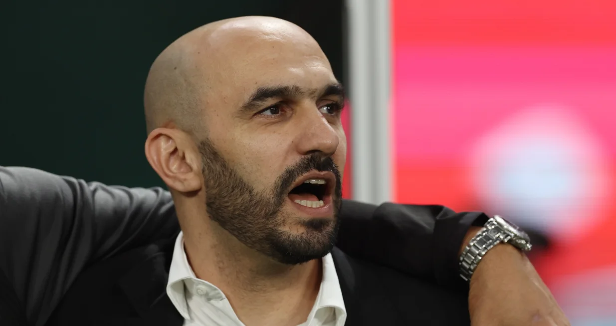 epa10370107 Head coach Walid Regragui of Morocco sings the national anthem before the FIFA World Cup 2022 third place soccer match between Croatia and Morocco at Khalifa International Stadium in Doha, Qatar, 17 December 2022. EPA/Tolga Bozoglu