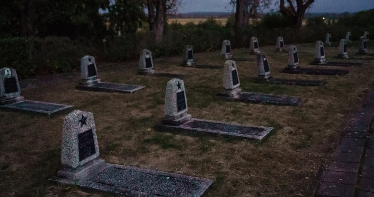 epa08697792 Tombstones of Russian soldiers pictured during a memorial concert on the occasion of the end of WWII, 75 years ago, in Seelow, Brandenburg, Germany, 25 September 2020. On the Seelower Heights (Seelower Hoehen), from 16 to 19 April 1945 one of the bloodiest battles of the Second World War took place The concert in commemoration, had to be canceled in may 2020, due to the coronavirus crisis. The Brandenburgisches Staatsorchester Frankfurt performed the 7th Symphony in C major, op. 60 by Dmitri Shostakovich, the "Leningrad Symphony". EPA/CLEMENS BILAN/Clemens Bilan