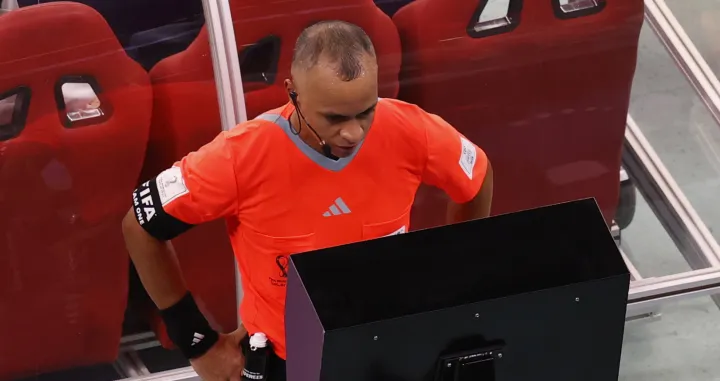 epa10360300 Brazilian referee Wilton Pereira Sampaio uses the VAR system during the FIFA World Cup 2022 quarter final soccer match between England and France at Al Bayt Stadium in Al Khor, Qatar, 10 December 2022. EPA/Rungroj Yongrit