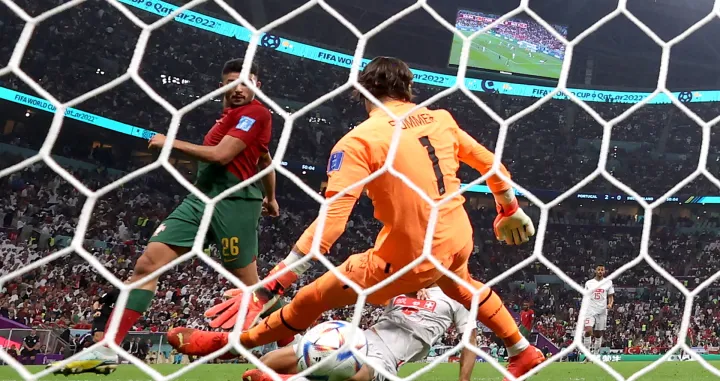 epa10352998 Goncalo Ramos of Portugal (L) scores the 3-0 against goalkeeper Yann Sommer of Switzerland during the FIFA World Cup 2022 round of 16 soccer match between Portugal and Switzerland at Lusail Stadium in Lusail, Qatar, 06 December 2022. EPA/Abedin Taherkenareh