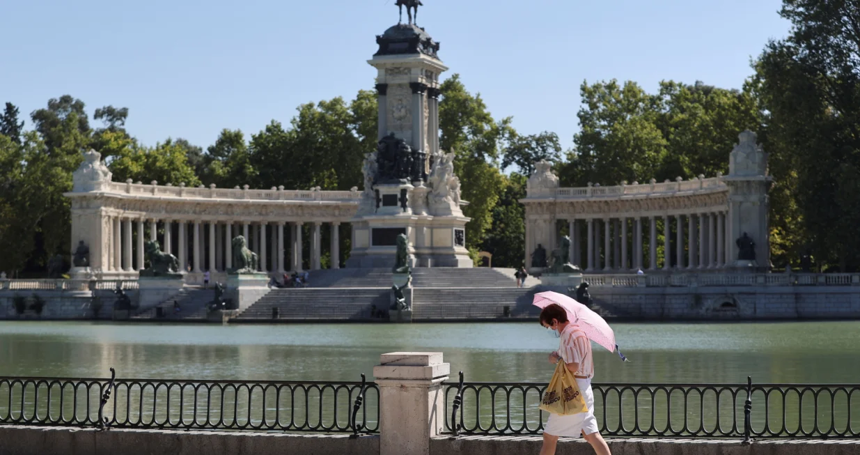 epa09365420 A woman walks in Retiro Park in Madrid, Spain, 25 July 2021, after the UNESCO added Madrid's historic Paseo del Prado boulevard and Retiro Park to its list of world heritage sites earlier on the day. Unesco World Heritage list committee decided the candidacy 'Landscape of Light', made up of the Paseo del Prado and the Buen Retiro park, would access the catalog in the category of the cultural landscape. EPA/Mariscal/Mariscal