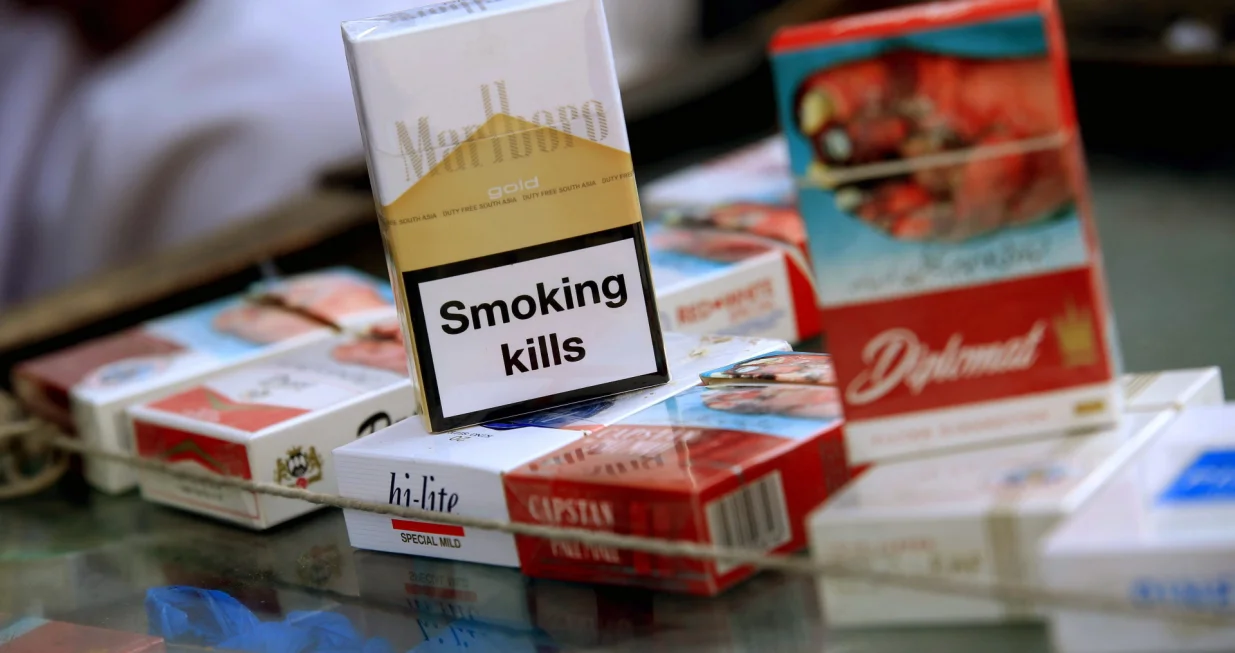epa09985828 Cigarette packs are displayed for sale at a shop a day ahead of World No Tobacco Day, in Peshawar, Pakistan, 30 May 2022. The World No Tobacco Day will be observed on 31 May across the world to emphasize all the risks associated with tobacco and stand for effective policies to reduce its consumption. The theme of World No Tobacco Day 2022 is 'Protect the environment'. EPA/BILAWAL ARBAB/Bilawal Arbab
