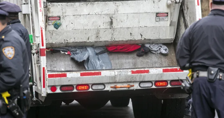 epa09874670 The final items of four tent encampment on 9th street off of Avenue B are processed by a garbage truck in New York, New York, USA, 06 April 2022. Activists and a homeless man were arrested for refusing to leave the encampment after police waited about seven hours before taking action. The people living in the encampment said they want housing, not shelter beds because they have not been safe at shelters in past experiences. EPA/SARAH YENESEL/Sarah Yenesel