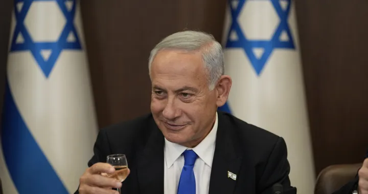 epa10381805 Newly sworn in Israeli Prime Minister Benjamin Netanyahu makes a toast during a cabinet meeting in Jerusalem, Israel, 29 December 2022. EPA/ARIEL SCHALIT/POOL/Ariel Schalit/Pool