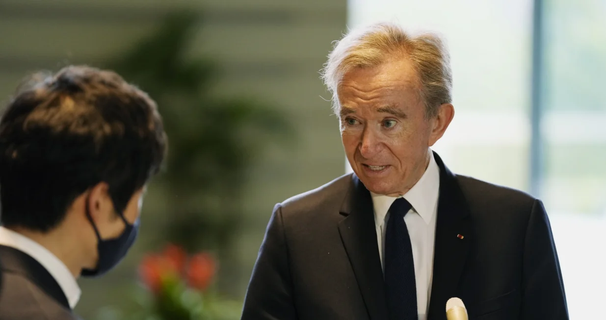 epa09922193 LVMH Moet Hennessy Louis Vuitton CEO Bernard Arnault (R) speaks to the press following his meeting with Japanese Chief Cabinet Secretary Hirokazu Matsuno (not pictured) at the Prime Minister's Office in Tokyo, Japan, 02 May 2022. EPA/Hiro Komae/POOL/Hiro Komae/Pool