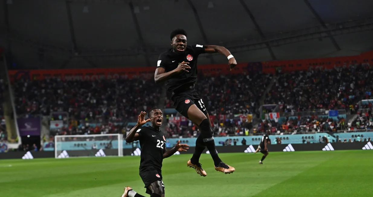 epa10332777 Alphonso Davies of Canada celebrates scoring the 0-1 goal during the FIFA World Cup 2022 group F soccer match between Croatia and Canada at Khalifa International Stadium in Doha, Qatar, 27 November 2022. EPA/Noushad Thekkayil