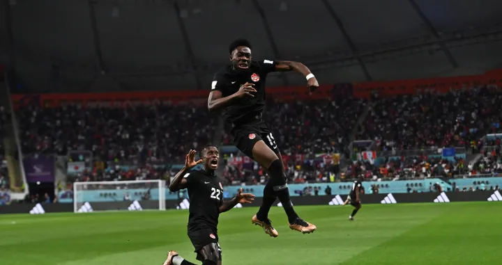 epa10332777 Alphonso Davies of Canada celebrates scoring the 0-1 goal during the FIFA World Cup 2022 group F soccer match between Croatia and Canada at Khalifa International Stadium in Doha, Qatar, 27 November 2022. EPA/Noushad Thekkayil