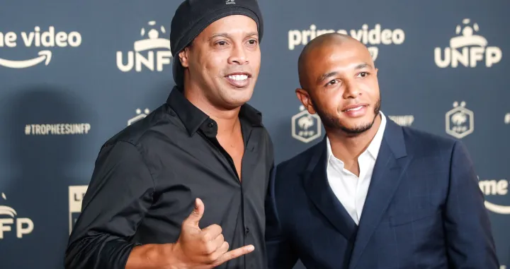 epa09949813 Former Brazilian soccer player Ronaldinho (L) poses as he arrives to the 30th edition of the UNFP 'French National Professional Football players' trophy ceremony at Pavillon Gabriel in Paris, France, 15 May 2022. EPA/Mohammed Badra
