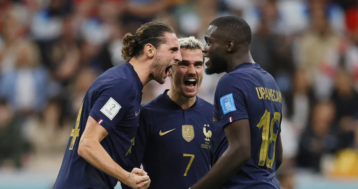 epa10360415 French players (L-R) Adrien Rabiot, Antoine Griezmann, and Dayot Upamecano celebrate after winning the FIFA World Cup 2022 quarter final soccer match between England and France at Al Bayt Stadium in Al Khor, Qatar, 10 December 2022. EPA/Ronald Wittek