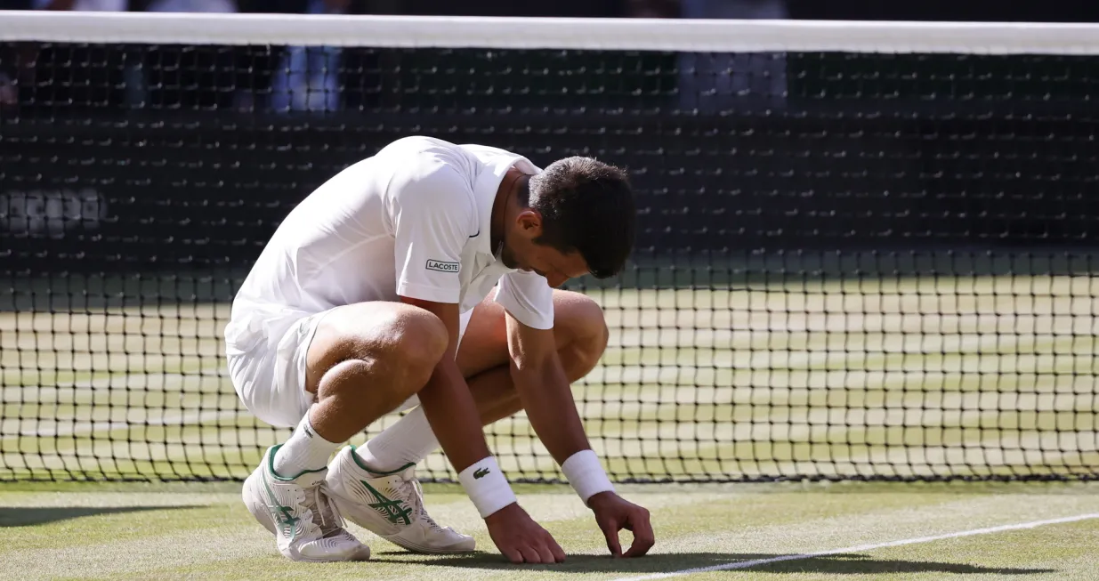 epa10064114 Novak Djokovic of Serbia after winning the men's final match against Nick Kyrgios of Australia at the Wimbledon Championships, in Wimbledon, Britain, 10 July 2022. EPA/TOLGA AKMEN  EDITORIAL USE ONLY