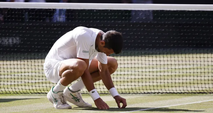 epa10064114 Novak Djokovic of Serbia after winning the men's final match against Nick Kyrgios of Australia at the Wimbledon Championships, in Wimbledon, Britain, 10 July 2022. EPA/TOLGA AKMEN  EDITORIAL USE ONLY