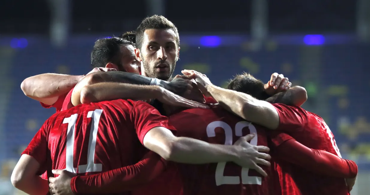 epa09243915 Georges Mikautadze (2-R) of Georgia celebrates with teammates after scoring the 1-0 lead during the International Friendly soccer match between Romania and Georgia in Ploiesti, Romania, 02 June 2021. EPA/ROBERT GHEMENT