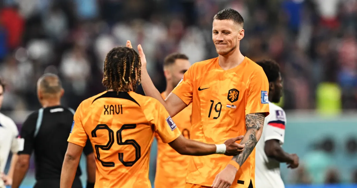 epa10346490 Xavi Simons and Wout Weghorst of the Netherlands celebrate after the FIFA World Cup 2022 round of 16 soccer match between the Netherlands and the USA at Khalifa International Stadium in Doha, Qatar, 03 December 2022. EPA/Noushad Thekkayil