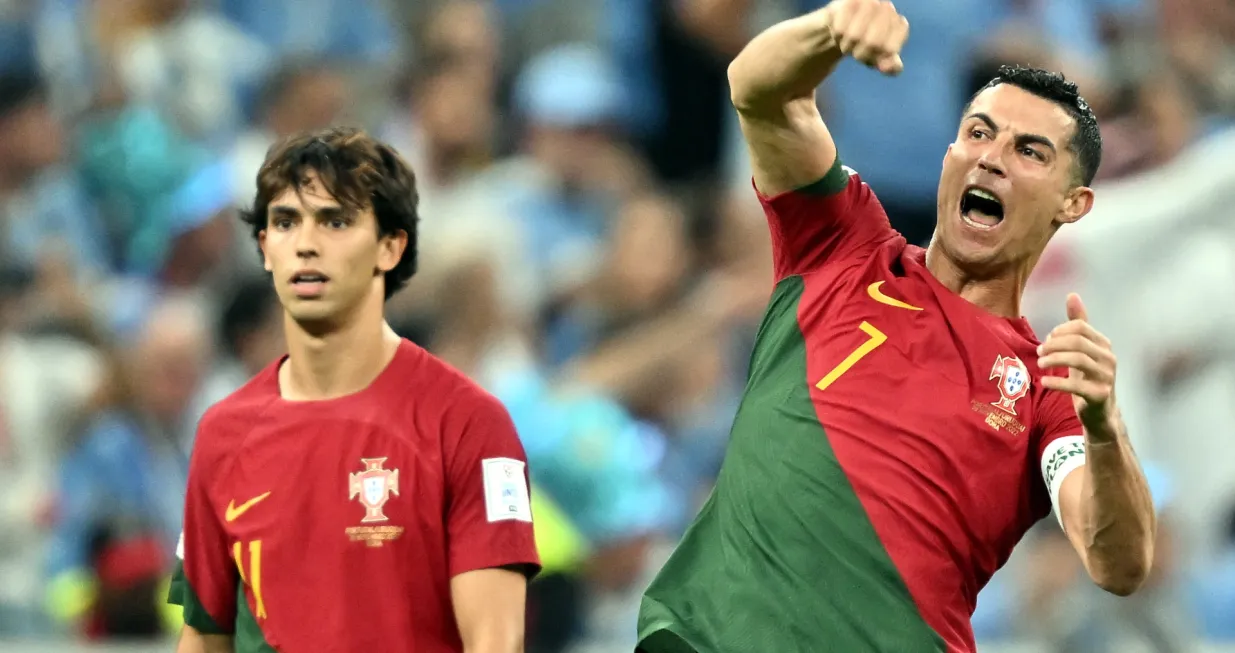 epa10335294 Cristiano Ronaldo (R) and Joao Felix of Portugal react after the 1-0 during the FIFA World Cup 2022 group H soccer match between Portugal and Uruguay at Lusail Stadium in Lusail, Qatar, 28 November 2022. EPA/Noushad Thekkayil