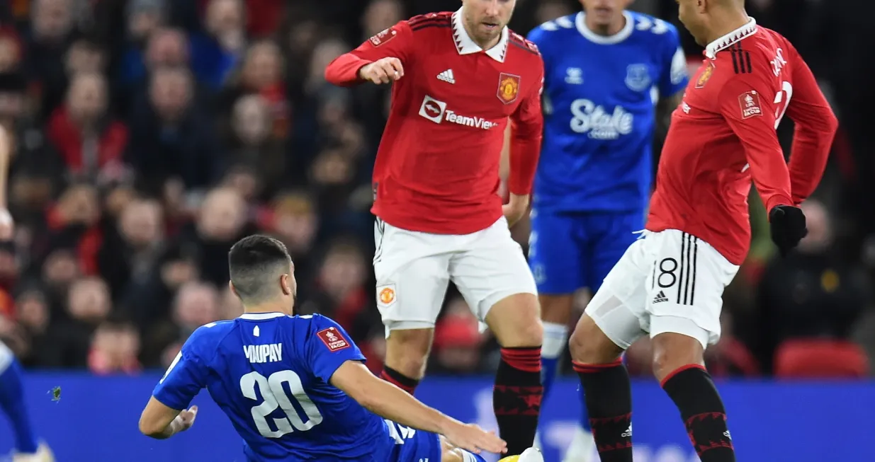 epa10393032 Manchester United's Casemiro (R) in action against Everton's Neal Maupay (down) during the FA Cup third round match between Manchester United and Everton in Manchester, Britain, 06 January 2023. EPA/Peter Powell EDITORIAL USE ONLY. No use with unauthorized audio, video, data, fixture lists, club/league logos or 'live' services. Online in-match use limited to 120 images, no video emulation. No use in betting, games or single club/league/player publications