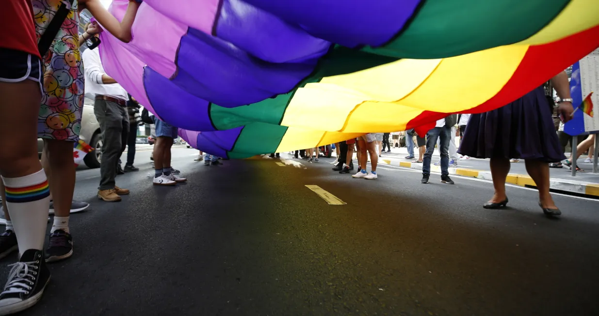 epa10332031 People carry a large rainbow colored flag as they take part in the parade to mark Thailand Pride Festival 2022 in Bangkok, Thailand, 27 November 2022. Thailand's LGBTQI groups and foreigners attended the Pride festival to raise awareness and promote sexual diversity and equal rights for the Lesbian, Gay, Bisexual, Transgender and Queer (LGBTQ) community. The festival also aims to promote tourism in Thailand as Covid-19 restrictions are being lifted, with hopes to becomes an annual and sustainable event in November. EPA/NARONG SANGNAK/Narong Sangnak