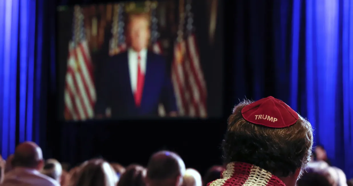 epa10315181 An attendee wearing a 'Trump' kippah listens to former US President Donald Trump speak remotely during the 2022 Republican Jewish Coalition Annual Leadership Meeting at the Venetian hotel and casino in Las Vegas, Nevada, USA, 19 November 2022. EPA/CAROLINE BREHMAN/Caroline Brehman