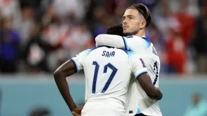 epa10360362 England players Bukayo Saka (L) and Jack Grealish (R) react after losing the FIFA World Cup 2022 quarter final soccer match between England and France at Al Bayt Stadium in Al Khor, Qatar, 10 December 2022. EPA/Ronald Wittek