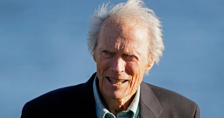 Clint Eastwood stands on the 18th green of the Pebble Beach Golf Links during the awards presentation of the AT&T Pebble Beach Pro-Am golf tournament in Pebble Beach, Calif., Sunday, Feb. 6, 2022. (AP Photo/Eric Risberg)/Eric Risberg