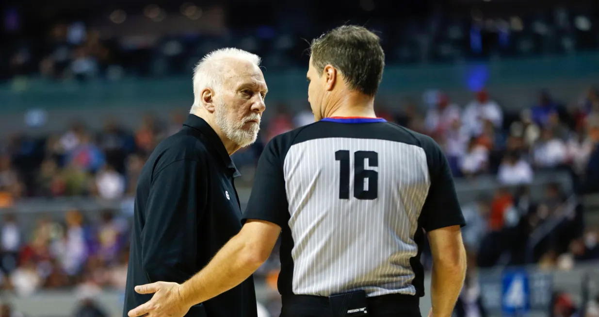 epa10371094 San Antonio Spurs head coach Gregg Popovich (L) speaks with a referee during an NBA game between the Miami Heat and the San Antonio Spurs, in Mexico City, Mexico, 17 December 2022. EPA/Isaac Esquivel SHUTTERSTOCK OUT