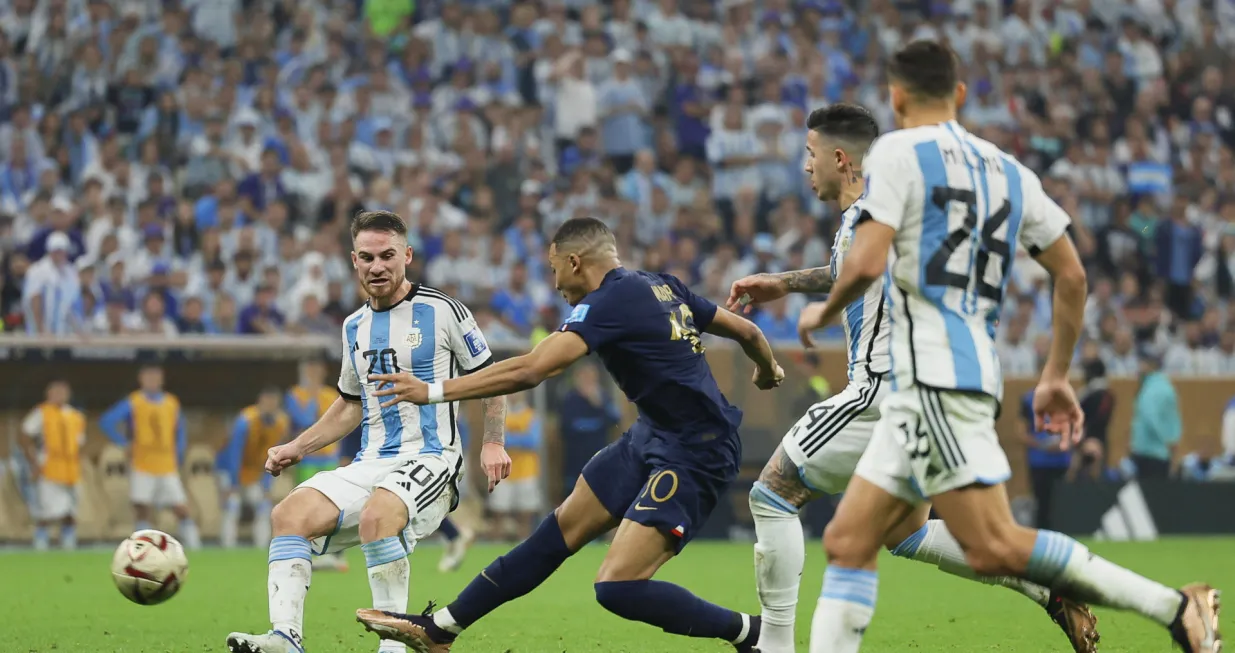 epa10372656 Kylian Mbappe (2-L) of France in action against Alexis Mac Allister (L) of Argentina during the FIFA World Cup 2022 Final between Argentina and France at Lusail stadium, Lusail, Qatar, 18 December 2022. EPA/Ronald Wittek