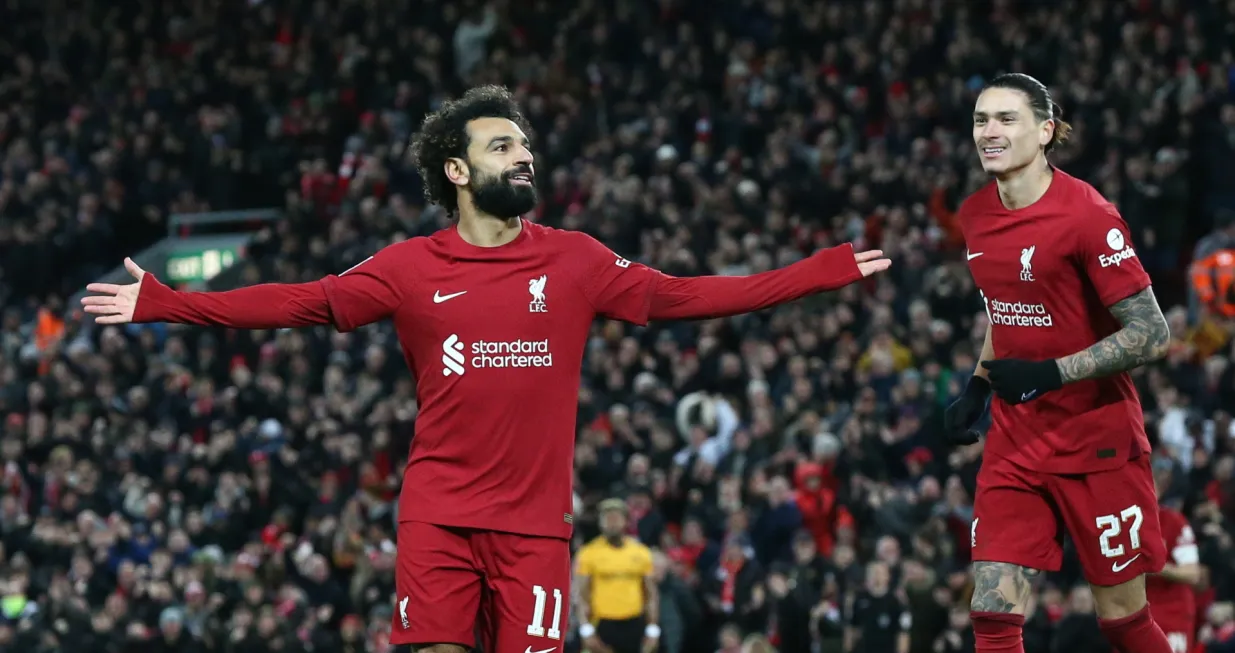 epa10394854 Mohamed Salah of Liverpool (L) celebrates with Darwin Nunez of Liverpool (R) after scoring the 2-1 goal during the 3rd round FA Cup soccer match between Liverpool and Wolverhampton Wanderers at Anfield in Liverpool, Britain, 07 January 2023. EPA/ADAM VAUGHAN