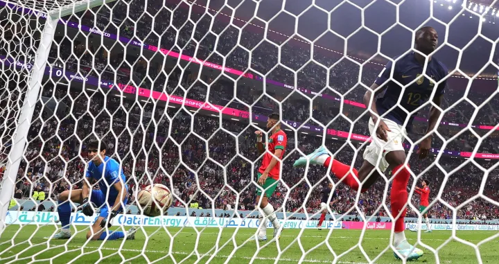 epa10366215 Randal Kolo Muani (R) of France celebrates scoring the 2-0 during the FIFA World Cup 2022 semi final between France and Morocco at Al Bayt Stadium in Al Khor, Qatar, 14 December 2022. EPA/Friedemann Vogel