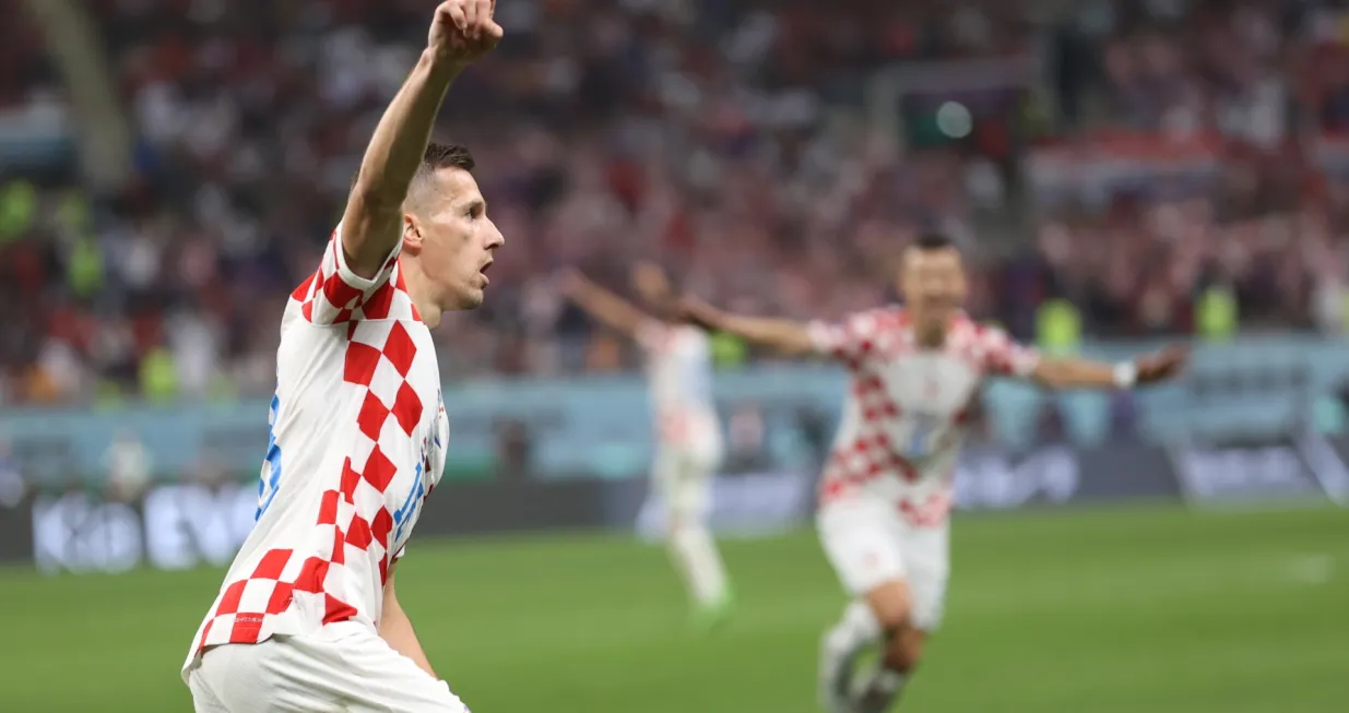 epaselect epa10370254 Mislav Orsic of Croatia celebrates after scoring the 2-1 lead during the FIFA World Cup 2022 third place soccer match between Croatia and Morocco at Khalifa International Stadium in Doha, Qatar, 17 December 2022. EPA/Tolga Bozoglu