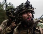 Royal Danish Army soldiers communicate with a radio during exercise Resolute Warrior 24 at Adaži, Latvia on 6 November 2024./NATO/