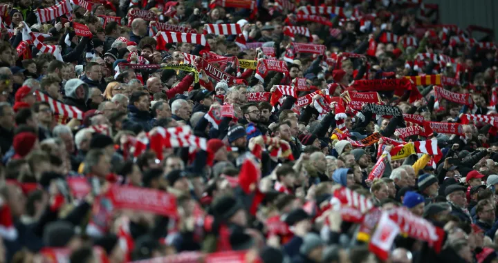 epa10394864 Liverpool supporters wave scarves ahead of the 3rd round FA Cup soccer match between Liverpool and Wolverhampton Wanderers at Anfield in Liverpool, Britain, 07 January 2023. EPA/ADAM VAUGHAN