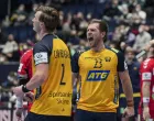 epa09709221 Jonathan Carlsbogard (L) and Albin Lagergren (R) of Sweden celebrate winning the Men's European Handball Championship main round match between Sweden and Norway in Bratislava, Slovakia, 25 January 2022. EPA/MARTIN DIVISEK