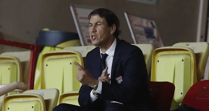 epa09174574 Lyon's head coach Rudi Garcia sits in the stands during the French Ligue 1 soccer match between AS Monaco and Olympique Lyonnais at the Louis II stadium, in Monaco, 02 May 2021. EPA/SEBASTIEN NOGIER