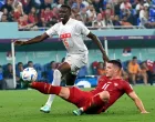 epa10345267 Luka Jovic (R) of Serbia in action against Denis Zakaria of Switzerland during the FIFA World Cup 2022 group G soccer match between Serbia and Switzerland at Stadium 947 in Doha, Qatar, 02 December 2022. EPA/Georgi Licovski