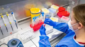 epa09708623 A molecular geneticist in protective clothing prepares a test for SARS-CoV-2 coronavirus which causes the COVID-19 disease, in a laboratory in the Rhineland Region, Germany, 25 January 2022. Certain groups of people in Germany will soon be prioritized for COVID-19 PCR testing, such as for the elderly, pre-diseased and healthcare workers. According to German Health Minister Lauterbach, the capacity of PCR tests is exhausted and the laboratories allocated for evaluation are also working to capacity. Therefore, it was decided to prioritize the PCR tests. EPA/SASCHA STEINBACH/Sascha Steinbach