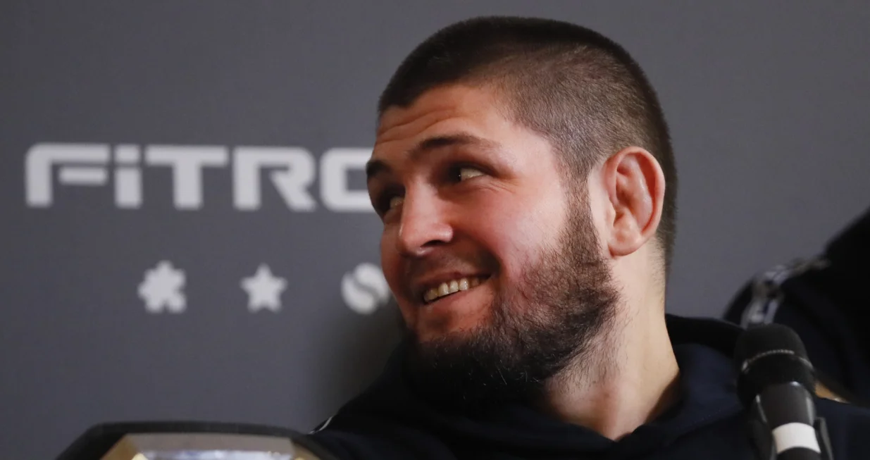 epa09640132 Former Russian mixed martial arts (MMA) fighter, UFC lightweight titleholder Khabib Nurmagomedov attends a press conference in Moscow, Russia, 13 December 2021. Nurmagomedov spoke about cooperation with the Fitroo brand and his team's plans for the coming year. EPA/YURI KOCHETKOV