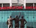 epa10322060 General view of the United Trinity statue and Old Trafford stadium in Manchester, Britain, 23 November 2022. Manchester United owners the Glazer family released a statement saying "the board has authorized a thorough evaluation of strategic alternatives", hinting at a sale of the club after 17 years of ownership. EPA/ADAM VAUGHAN