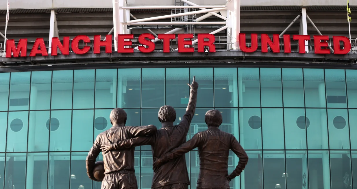 epa10322060 General view of the United Trinity statue and Old Trafford stadium in Manchester, Britain, 23 November 2022. Manchester United owners the Glazer family released a statement saying "the board has authorized a thorough evaluation of strategic alternatives", hinting at a sale of the club after 17 years of ownership. EPA/ADAM VAUGHAN