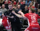 epa10367710 Kiels Sander Sagosen (L) and Aalborgs Kristian Bjoernsen in action during the Champions League handball match between Aalborg Handball and THW Kiel in Aalborg, Denmark, 15 December 2022. EPA/Henning Bagger DENMARK OUT