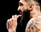 epa10183905 Vincent Poirier of France holds his teeths protector during the FIBA EuroBasket 2022 Quarter Finals match between Italy and France at EuroBasket Arena in Berlin, Germany, 14 September 2022. EPA/FILIP SINGER