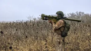 epa10300725 A member of Ukraine's National Guard with a man-portable surface-to-air missile system (MANPAD) keeps watch while standing at a position not far from Kharkiv, northeastern Ukraine, 11 November 2022, amid Russia's invasion. Kharkiv and surrounding areas have been the target of heavy shelling since February 2022, when Russian troops entered Ukraine starting a conflict that has provoked destruction and a humanitarian crisis. At the beginning of September, the Ukrainian army pushed Russian forces from occupied territory in the northeast of the country in counterattacks. EPA/SERGEY KOZLOV/Sergey Kozlov