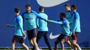 epa10292337 FC Barcelona's defender Gerard Pique (C-L) and striker Ansu Fati (C-R) attend a training session at Joan Gamper Sports City in Barcelona, Catalonia, Spain, 07 November 2022. EPA/Enric Fontcuberta