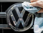 epa08442643 (FILE) - An assistant cleans a the logo of a VW Touareg SUV car prior to the annual general meeting (AGM) in Berlin, Germany, 03 May 2018 (reissued 25 May 2020). According to reports on 25 May 2020, German federal court in Karlsruhe issued a verdict in Volkswagen diesel emissions case, and said a customer can hand back to Volkswagen a car equipped with a diesel engine if the engine contained an illegal cheating device. Customer may also demand a partial refund of the purchasing price. EPA/CLEMENS BILAN *** Local Caption *** 54305844/Clemens Bilan