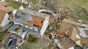 Debris lies around damaged houses the morning after a tornado touched down in Florissant, Missouri, U.S. March 15, 2025. REUTERS/Lawrence Bryant/Lawrence Bryant