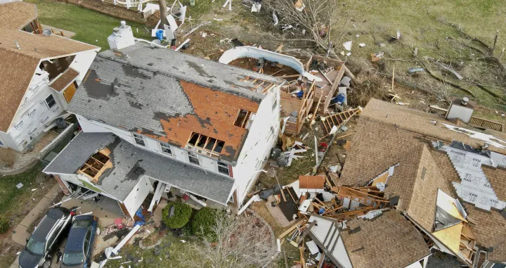 Debris lies around damaged houses the morning after a tornado touched down in Florissant, Missouri, U.S. March 15, 2025. REUTERS/Lawrence Bryant/Lawrence Bryant