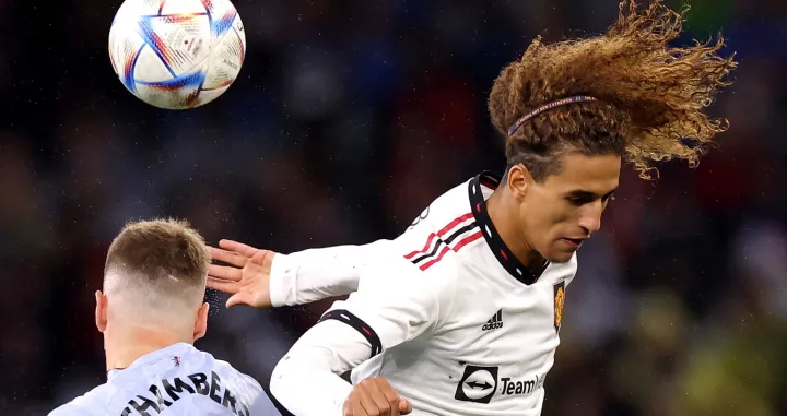 epaselect epa10087761 Calum Chambers (L) of Aston Villa and Hannibal Mejbri of Manchester United jump for the ball during the friendly soccer match between English Premier League sides Manchester United and Aston Villa at Optus Stadium in Perth, Australia, 23 July 2022. EPA/RICHARD WAINWRIGHT